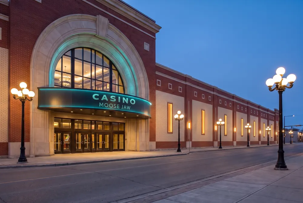 Arched entrance of Casino Moose Jaw at dusk